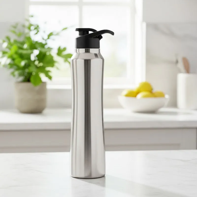 Silver steel bottle with black sipper cap on a kitchen counter