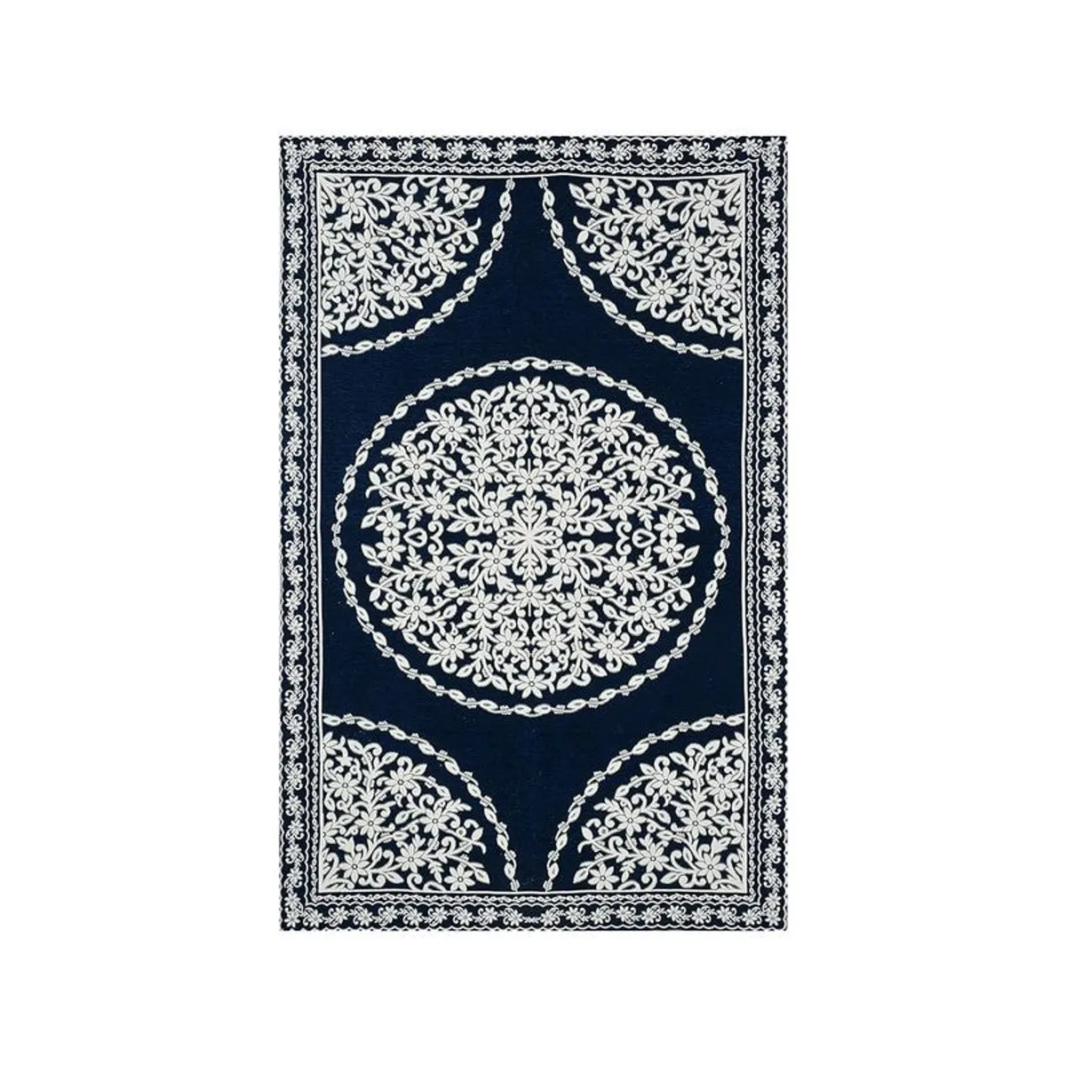 Flat view of blue rectangular table cover with ornate white floral border and medallions