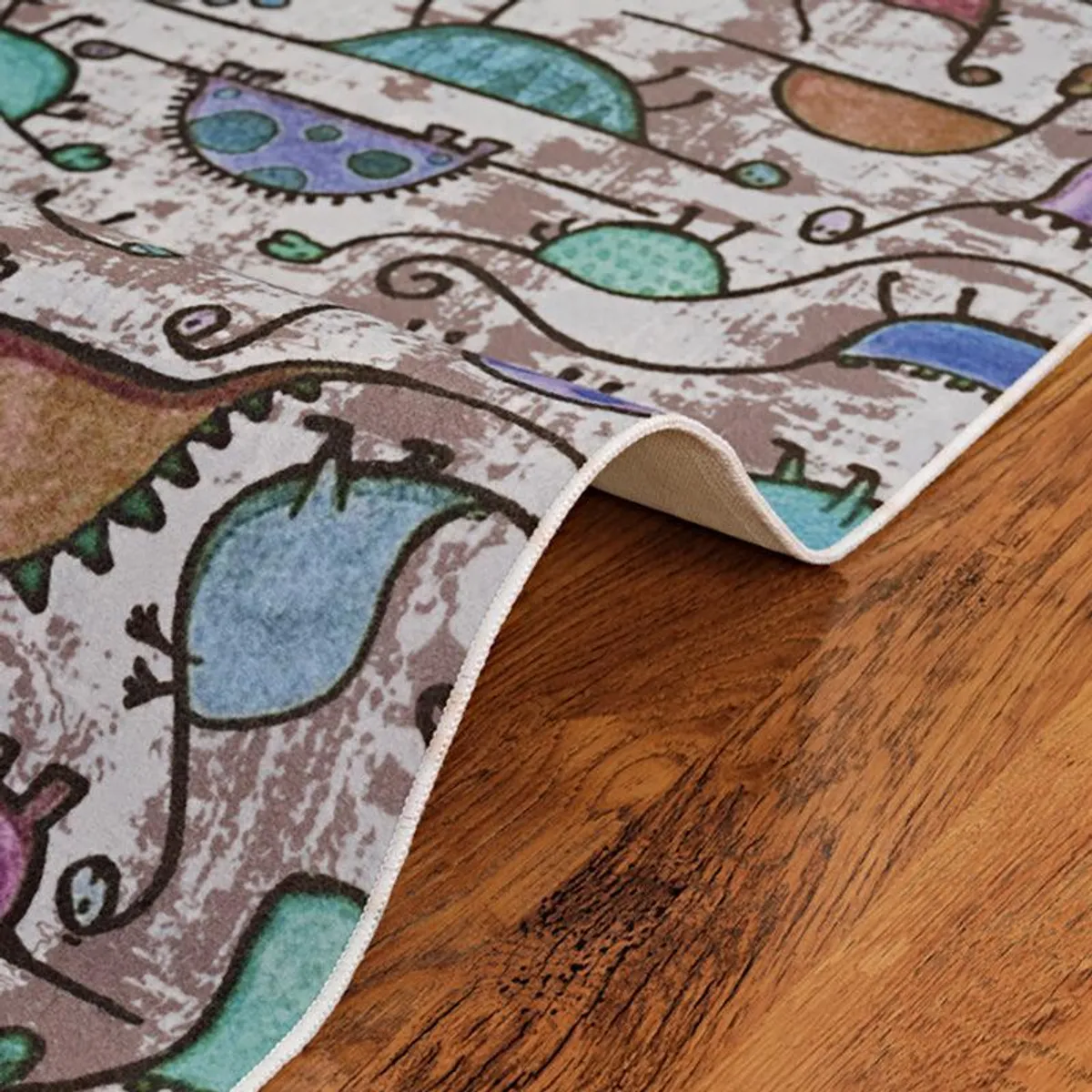 Corner view of the dinosaur carpet on wooden flooring
