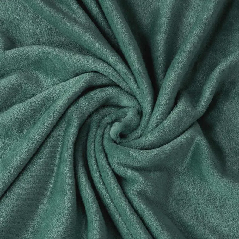 Close-up of dark green flannel fabric with a soft textured surface