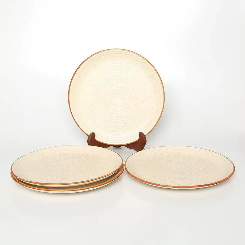 White quarter plates with speckled surface and earthy brown border