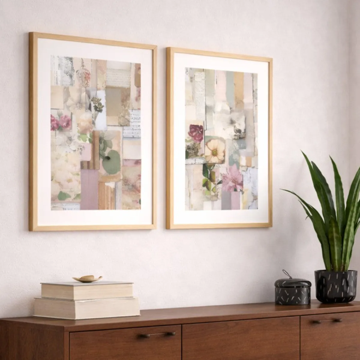Pair of muted floral framed artworks displayed above a wooden cabinet