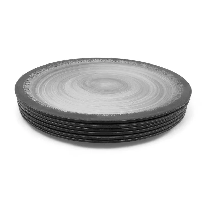 Stack of black and grey circular dinner plates on a white background