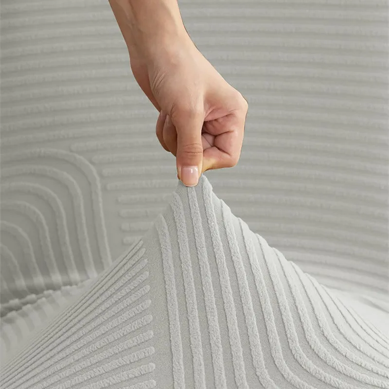 Close-up of grey chair cover fabric being stretched by hand