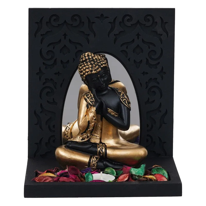 Straight view of Buddha tea light holder with decorative black panel and gold accents