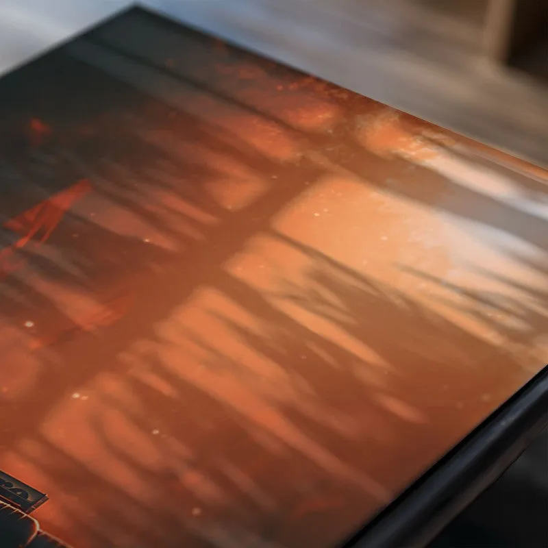 Close-up of poster artwork showing warm sunset tones and glossy finish