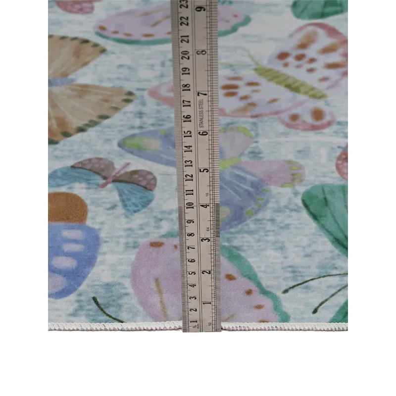 Close-up of butterfly carpet surface with ruler placed vertically