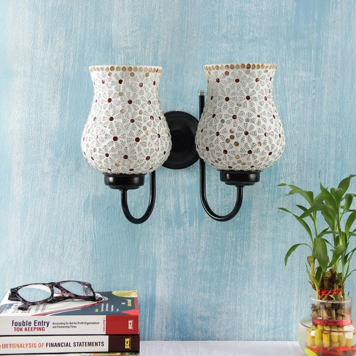 Unlit dual wall lamp with white patterned glass shades and black iron arm