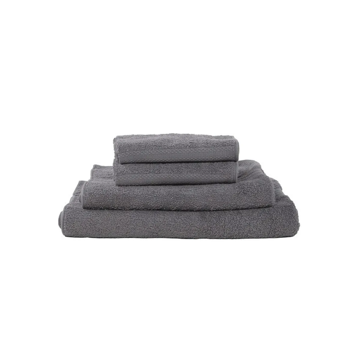 Stacked dark grey towels arranged by size on a white background