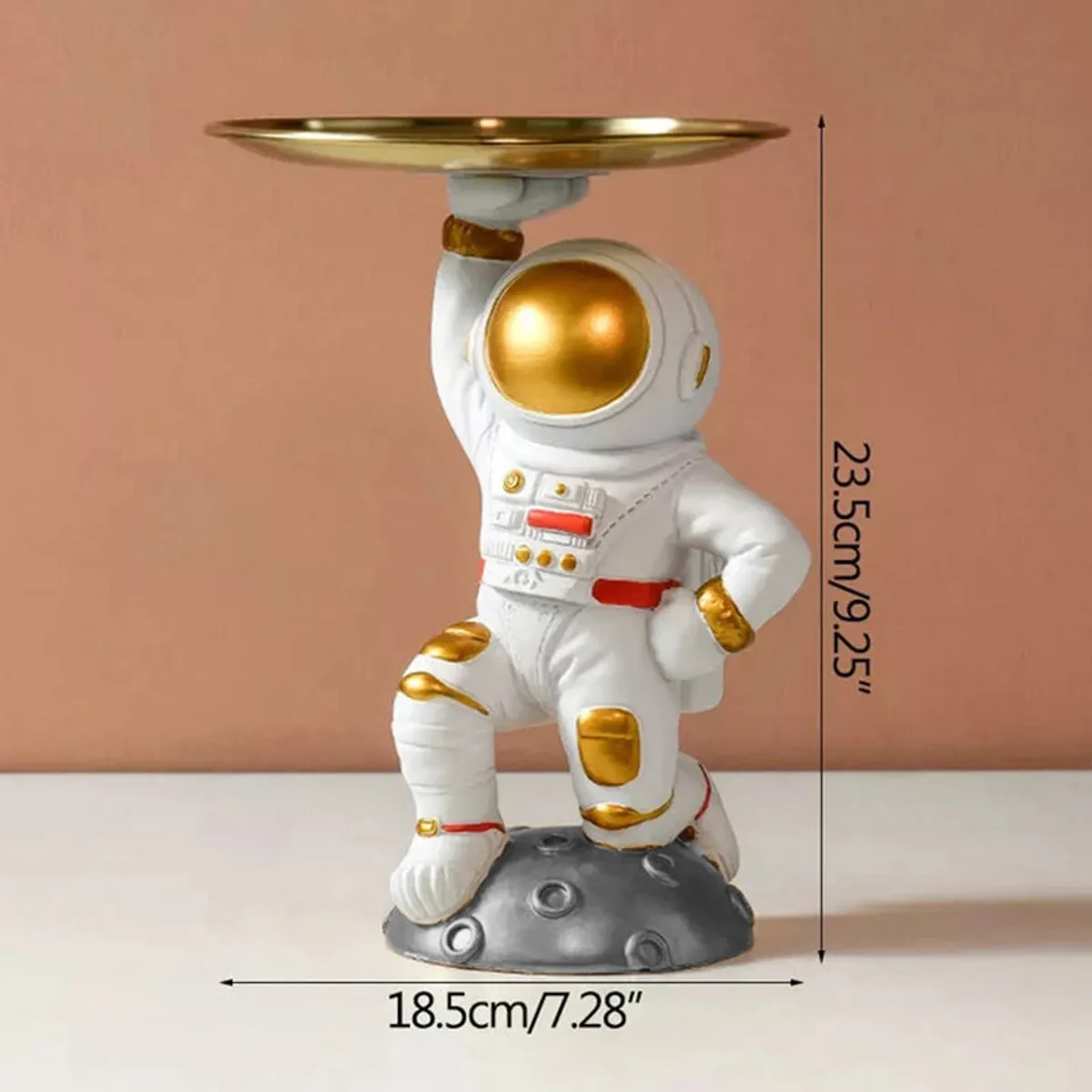 Astronaut showpiece with tray top against a plain backdrop