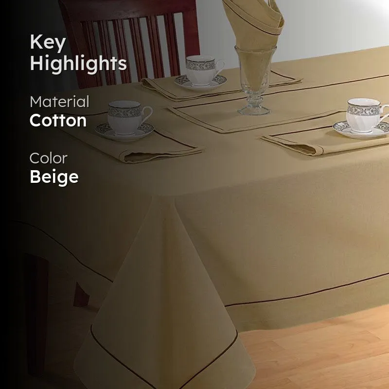 Beige table cover with brown border on a dining table