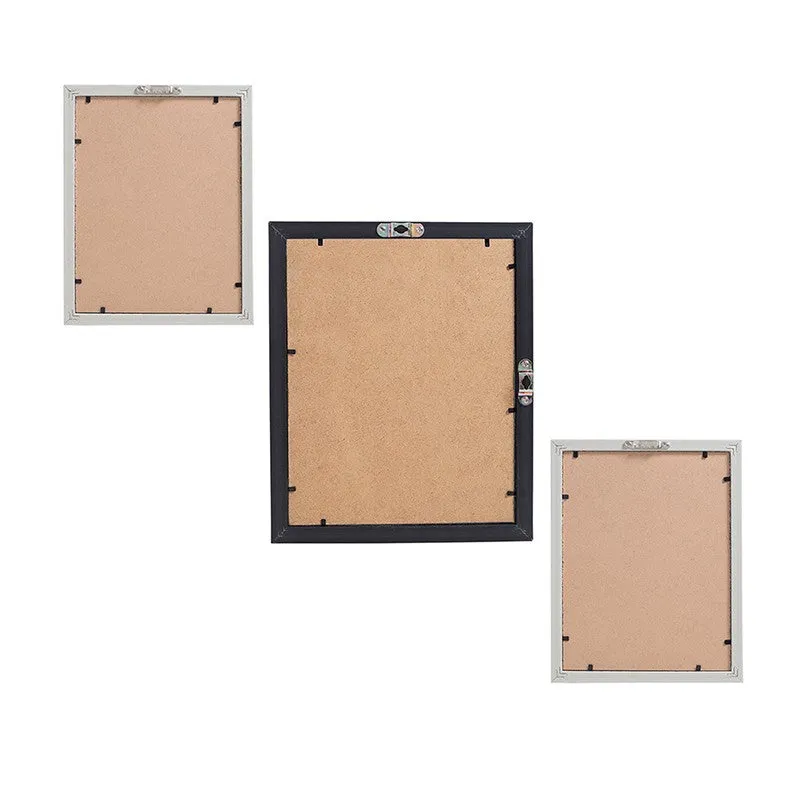 Back view of three rectangular wall art pieces with hanging hardware