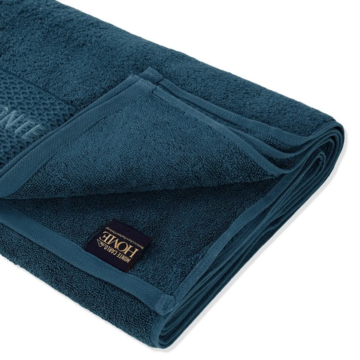 Close-up of the folded blue towel showing its plush texture and stitched label