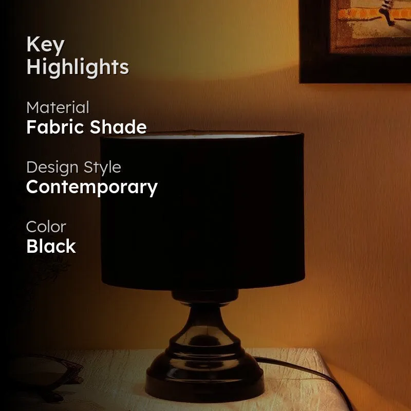 Black table lamp in a warm room setting with highlight text overlay