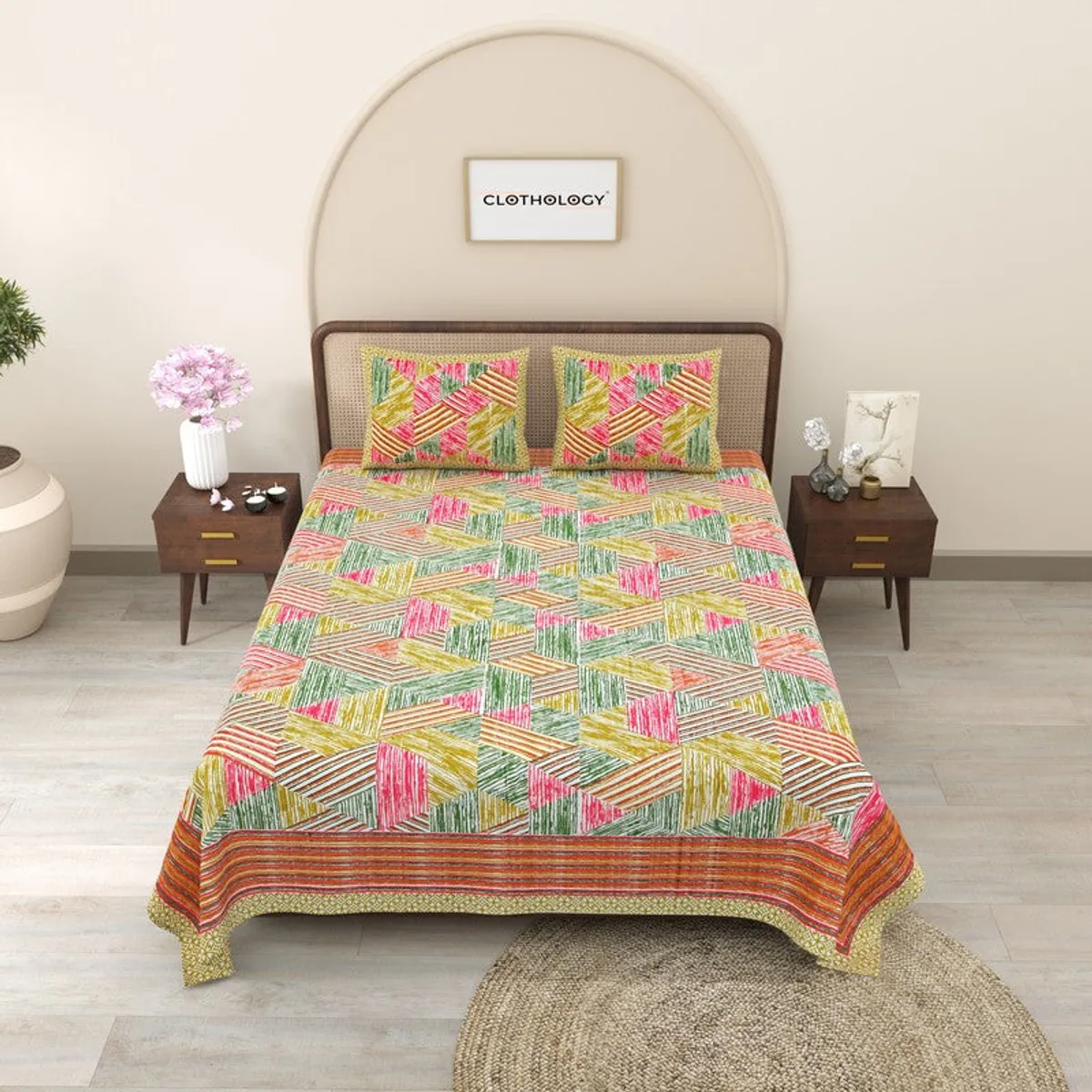 Full view of a bright geometric multicolour bedsheet on a king-size bed