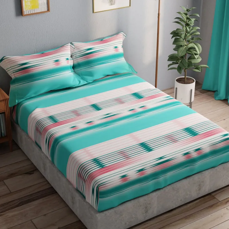 Queen bed dressed in sea green abstract striped cotton bedding