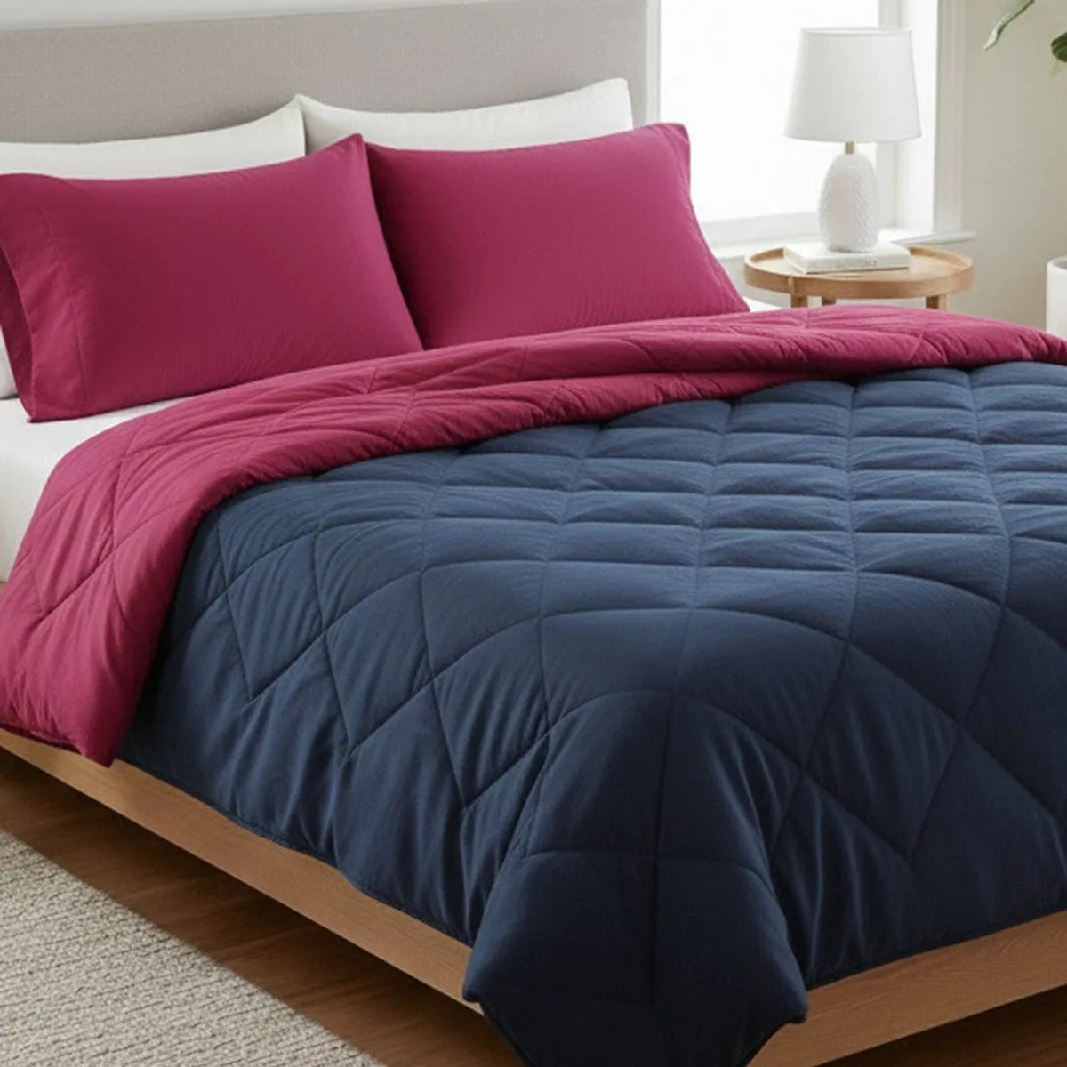 Close-up of the blue quilted comforter with its pink reversible side