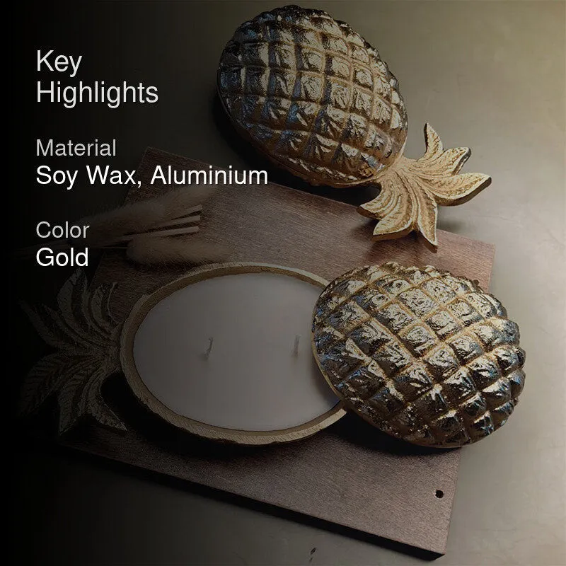 Gold pineapple-shaped candle jar with white wax and matching lid