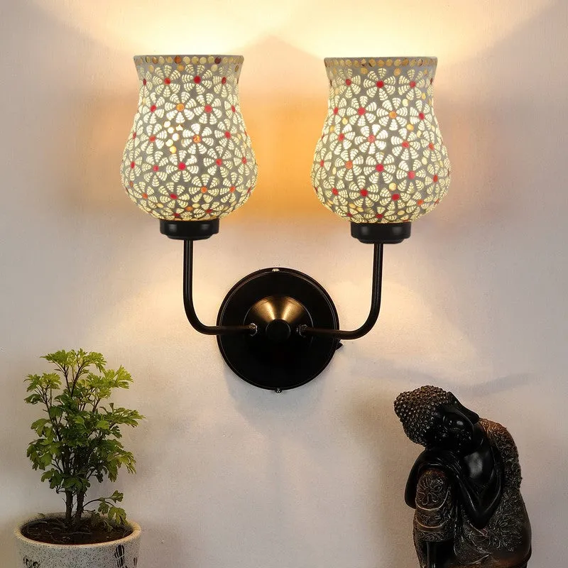 Twin ivory mosaic glass wall lamp mounted on a wall in a styled corner