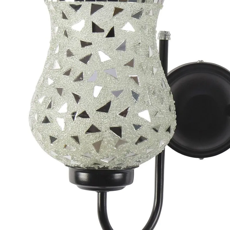 Close-up of silver mosaic glass shade and black wall mount