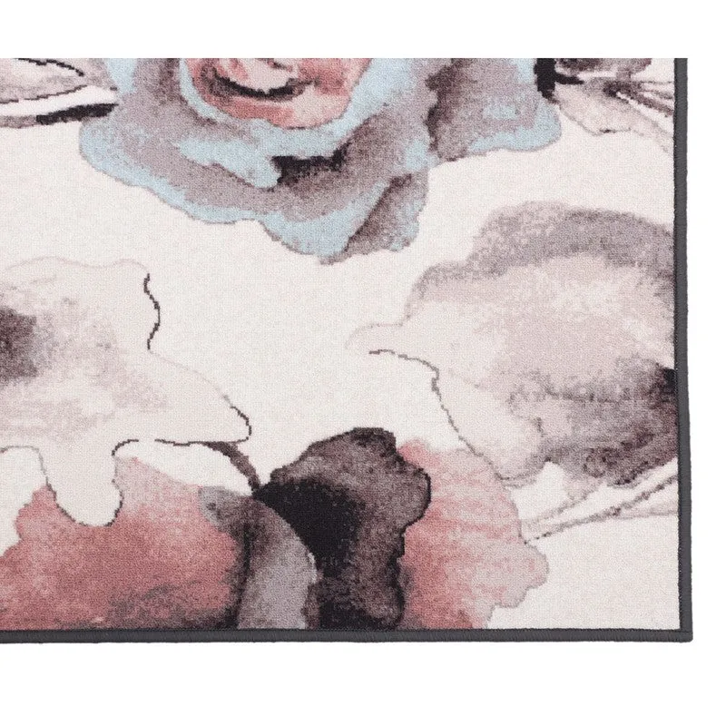 Close-up of the floral rug corner with peach and grey pattern