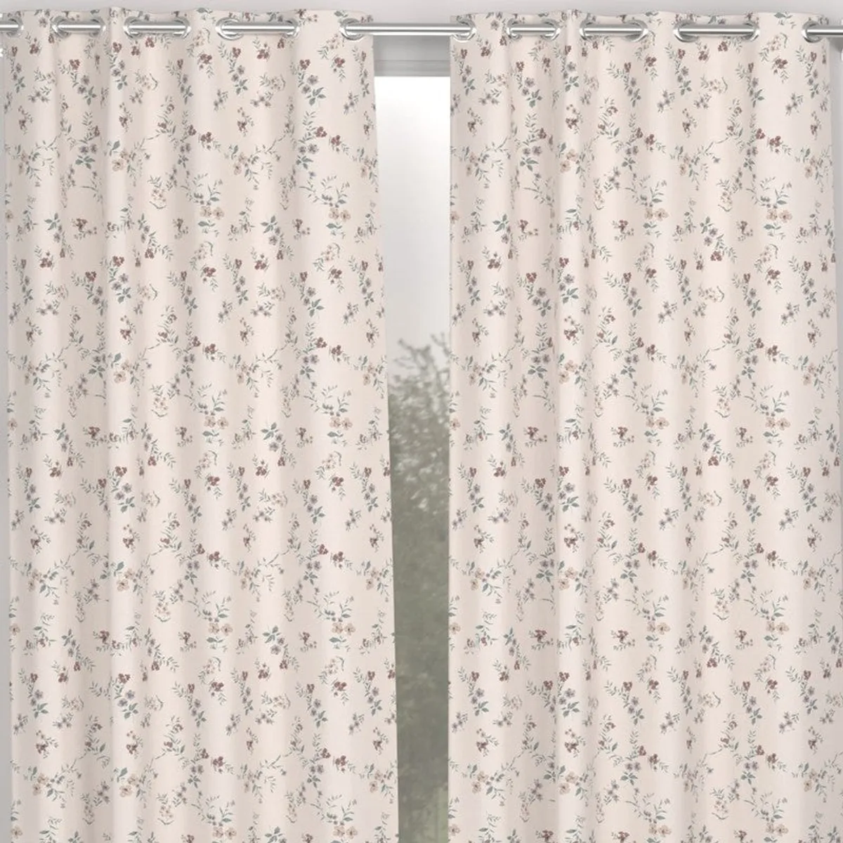Peach floral curtains shown with silver eyelets across a doorway