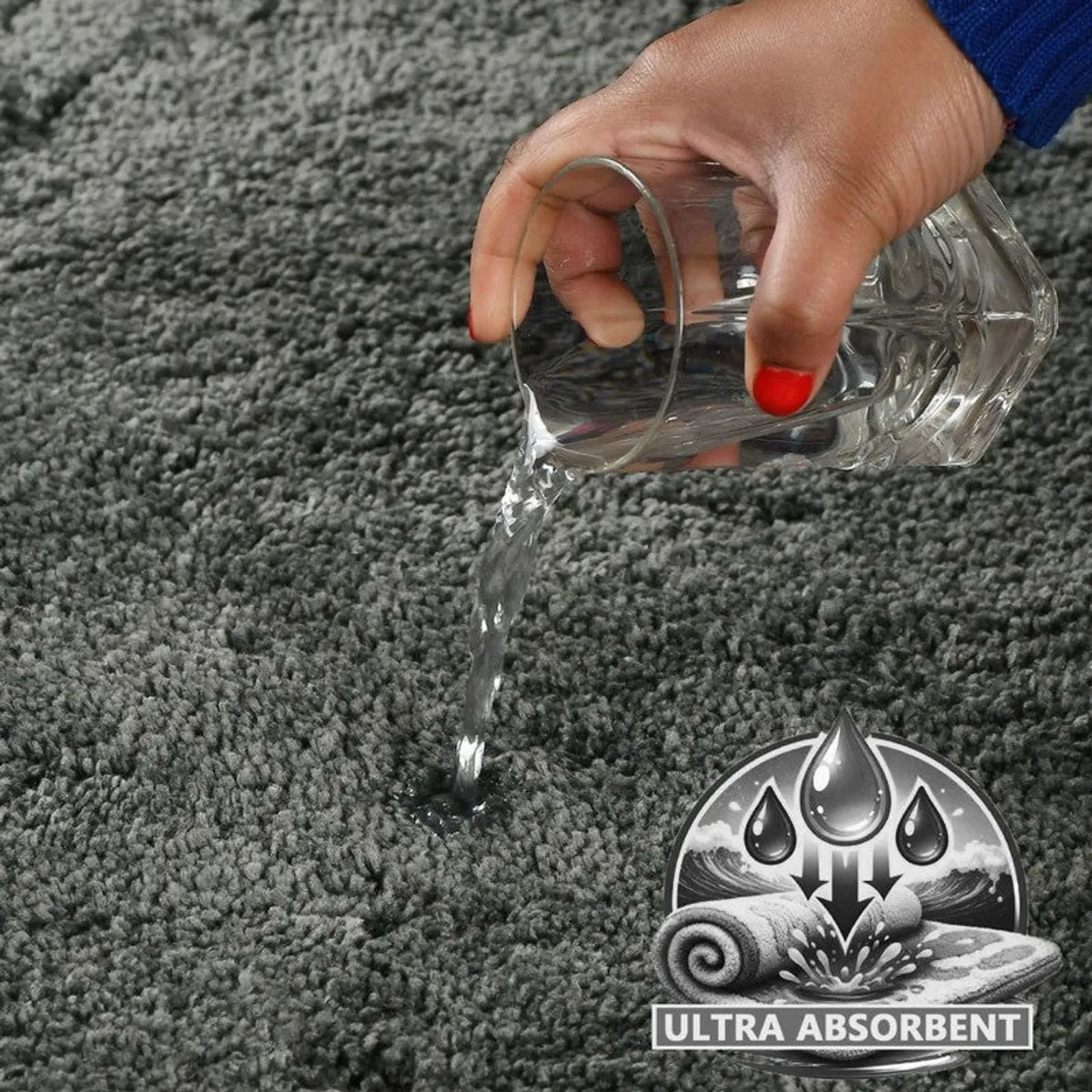 Water being poured onto the grey bath mat surface