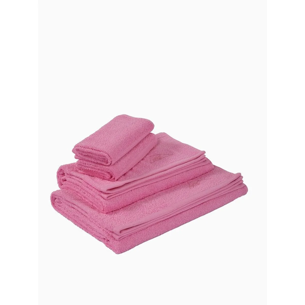Folded set of pink towels stacked on a white background