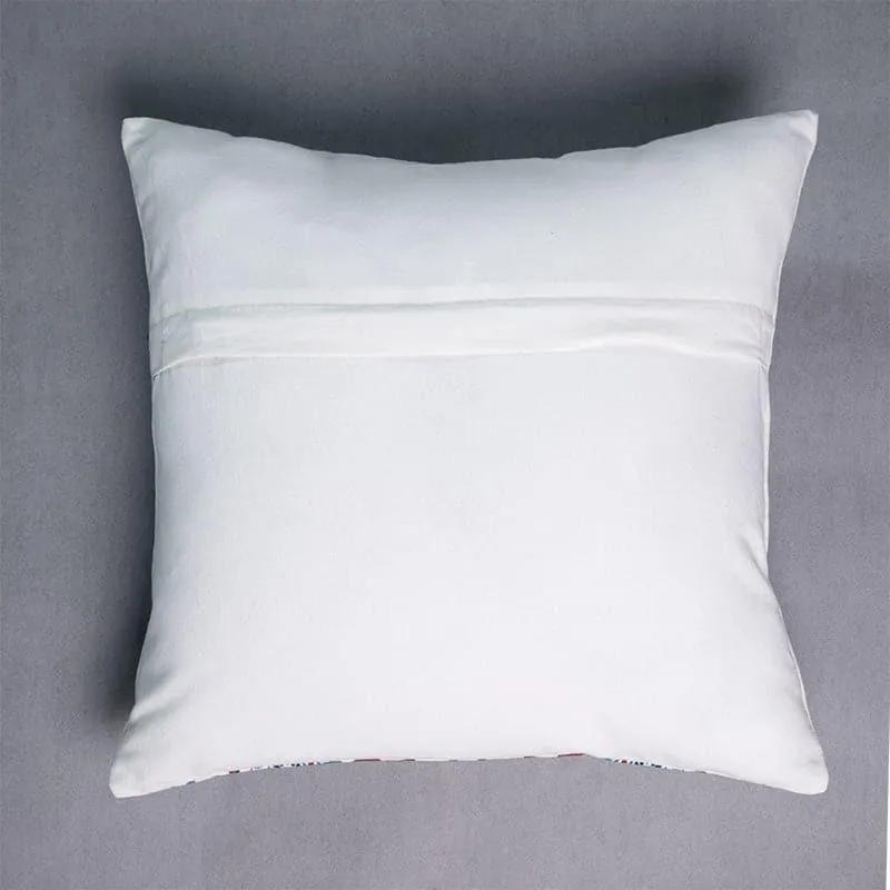 White reverse side of a square cushion cover with a horizontal seam.