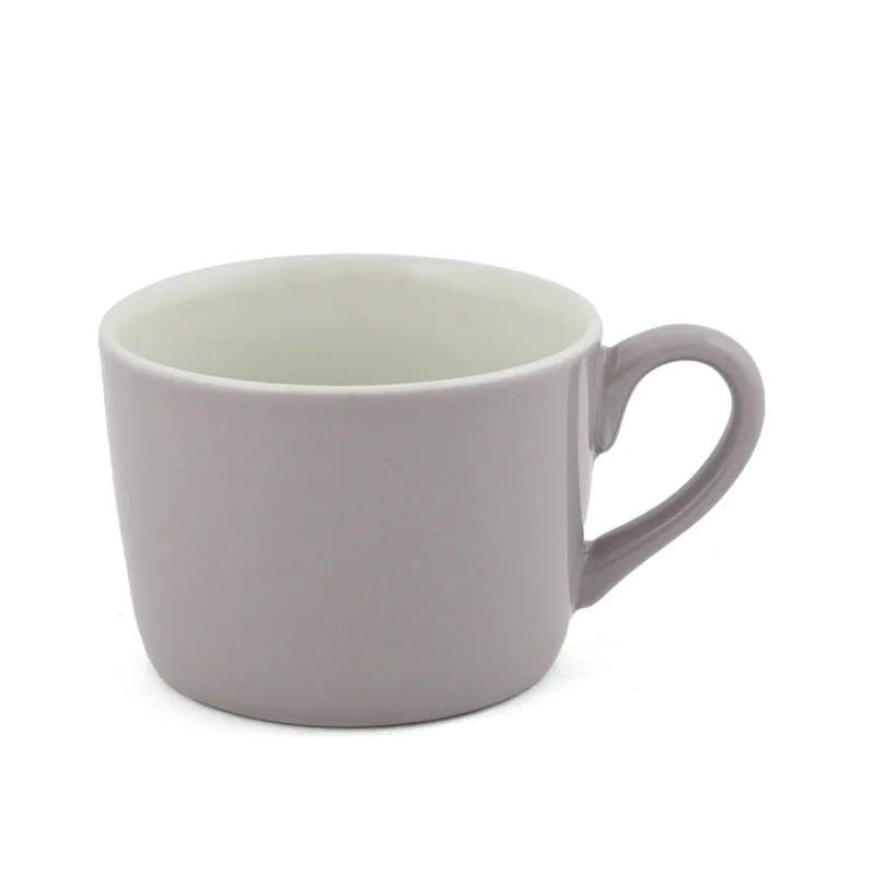 Single light purple porcelain cup on a white background