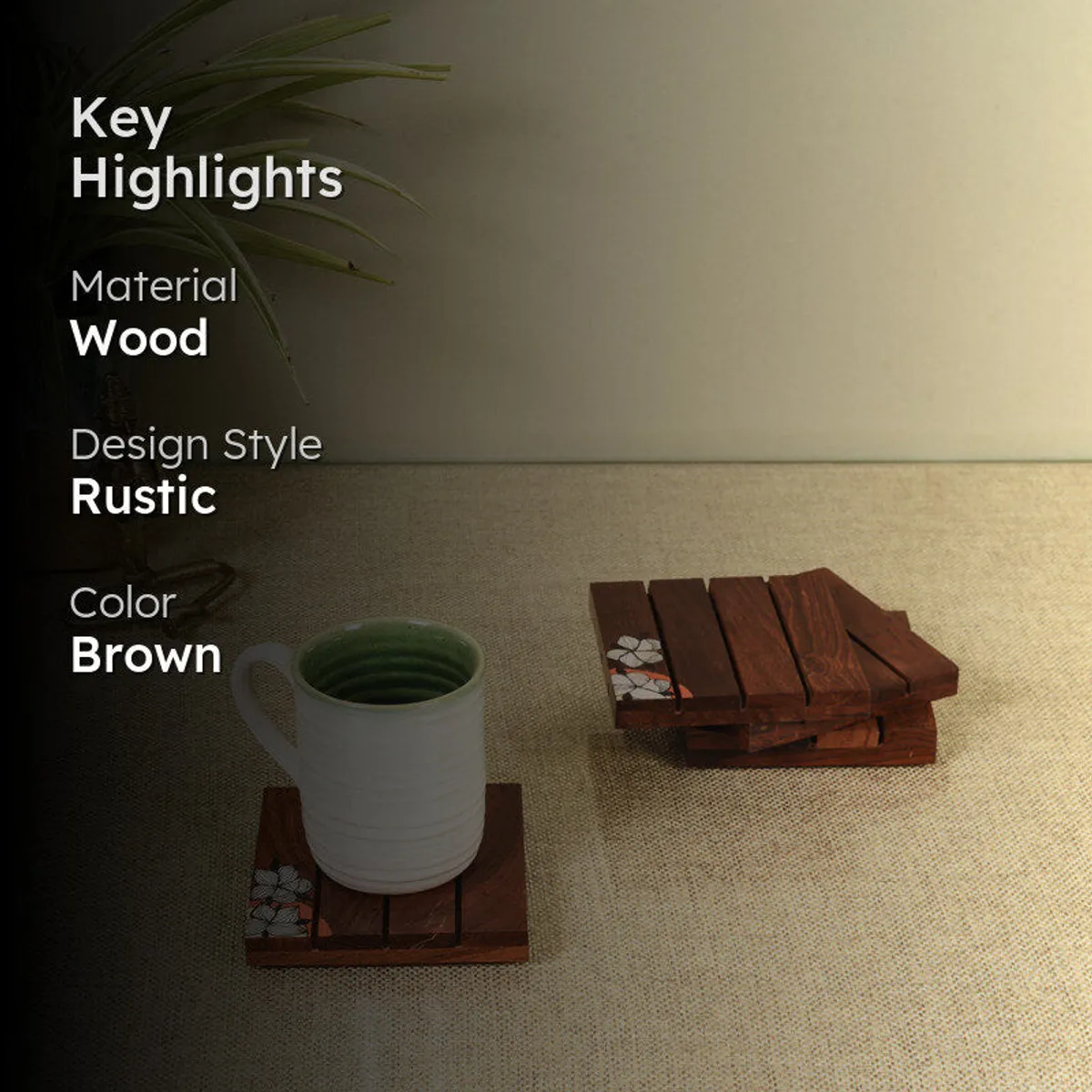 White mug on a coaster beside a stacked set of matching coasters on a tabletop