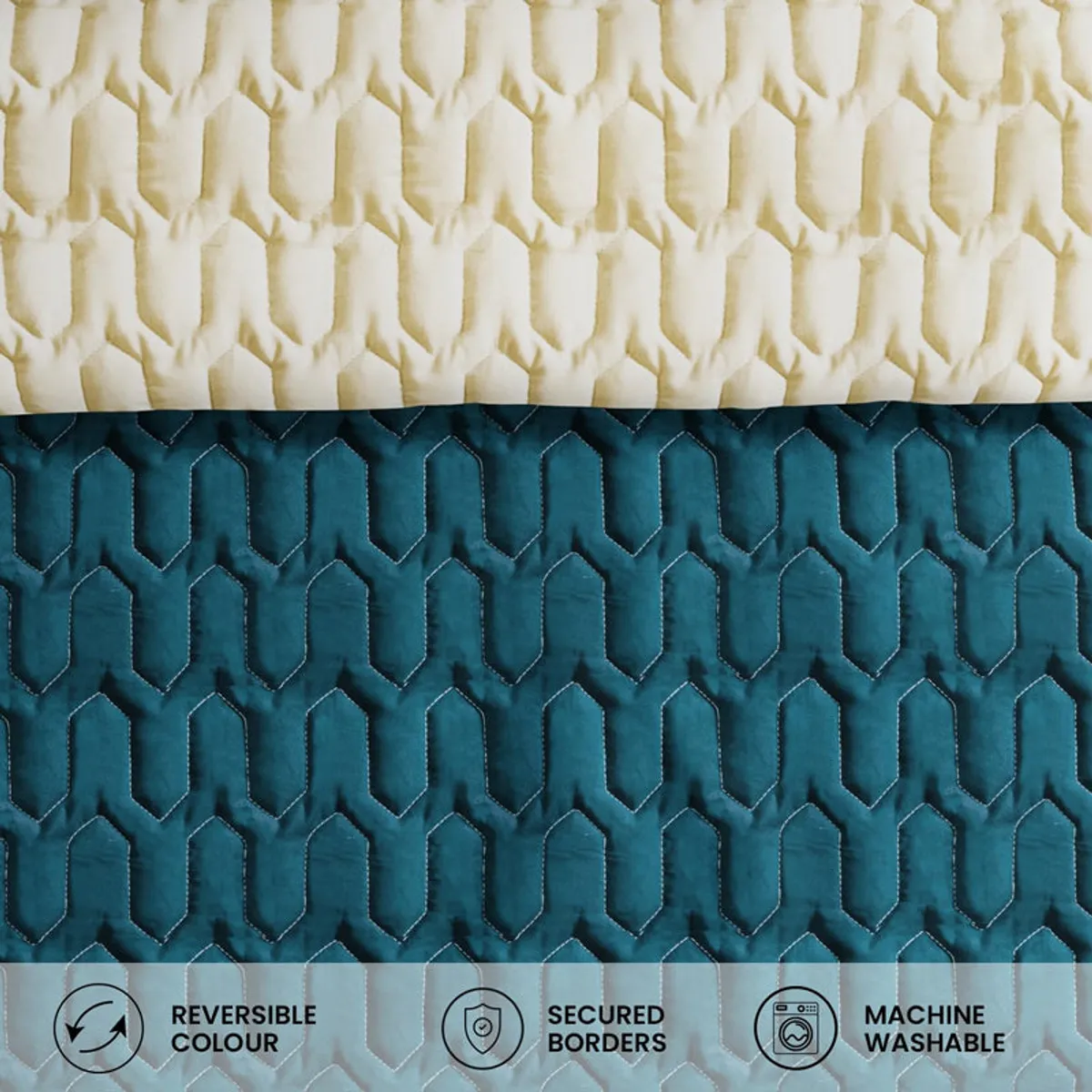 Close-up of the beige and teal quilted reversible comforter surfaces.