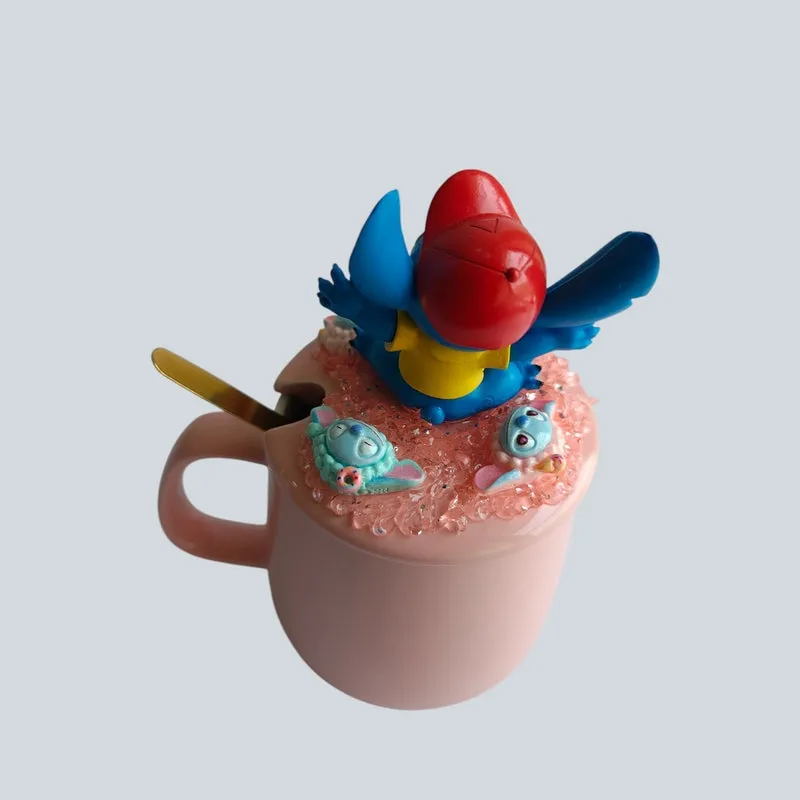 Top angled view of pink mug with raised Stitch figurine lid and spoon slot