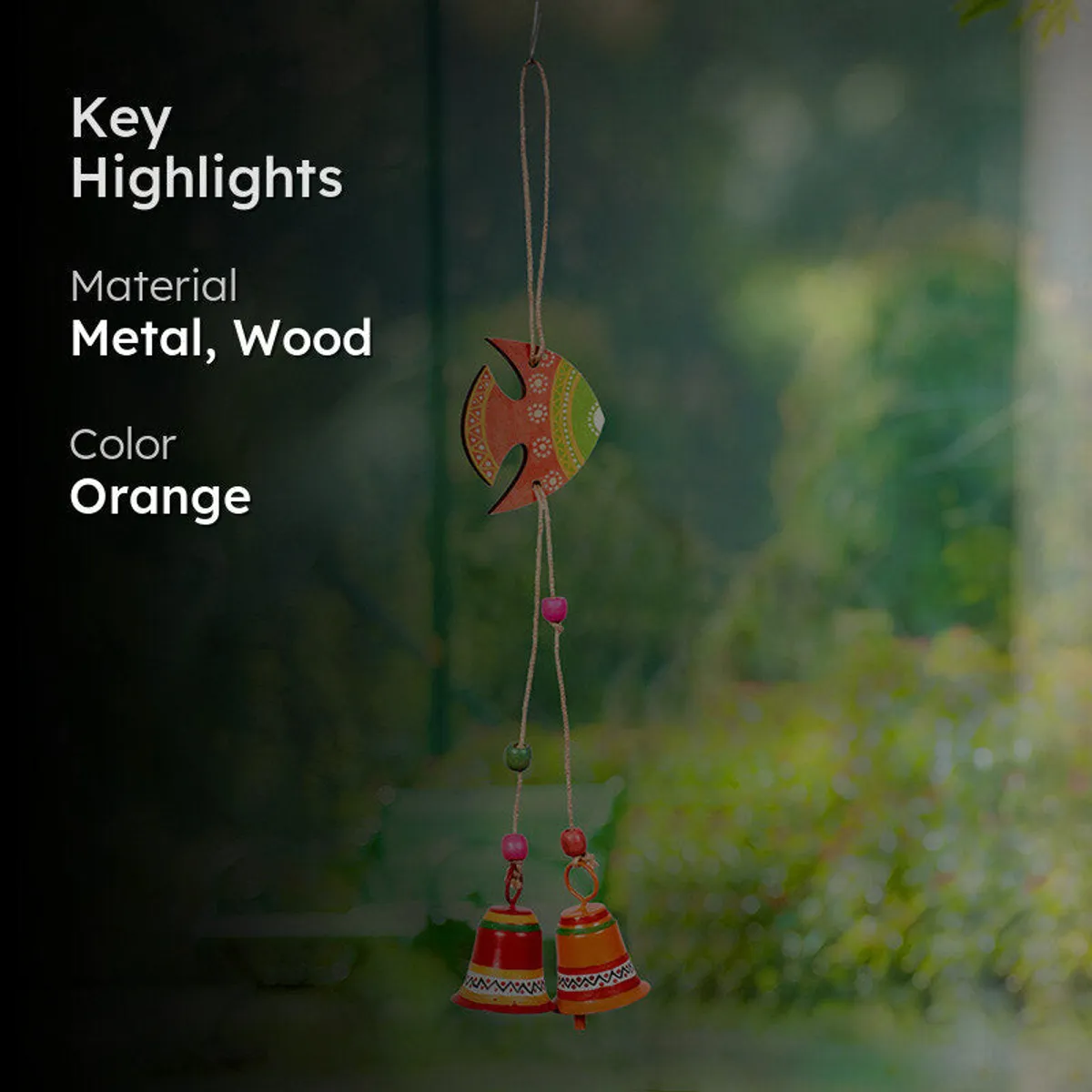 Orange and green fish windchime outdoors with material and colour highlights.
