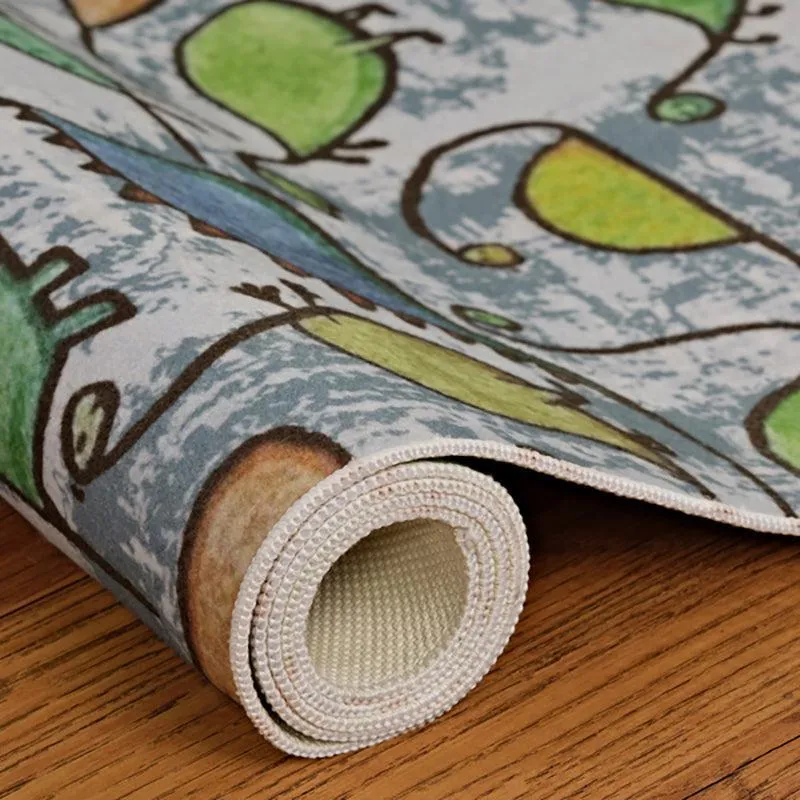 Rolled edge of dinosaur print carpet showing surface and backing