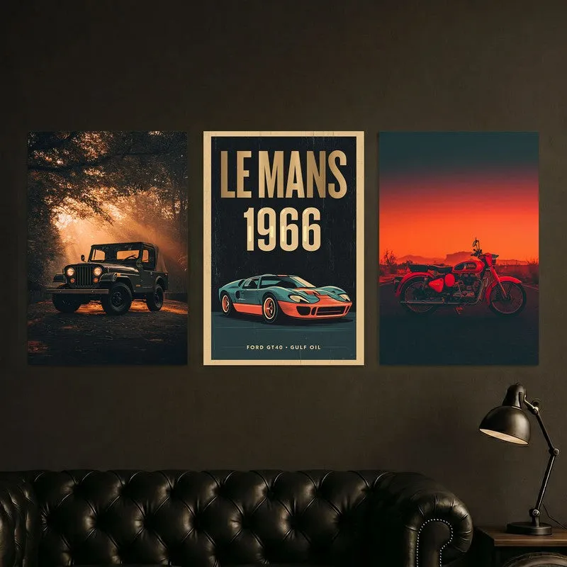 Three car and motorcycle posters displayed above a dark leather sofa