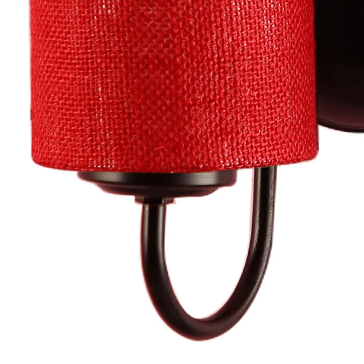 Close-up of red jute shade and black curved iron arm