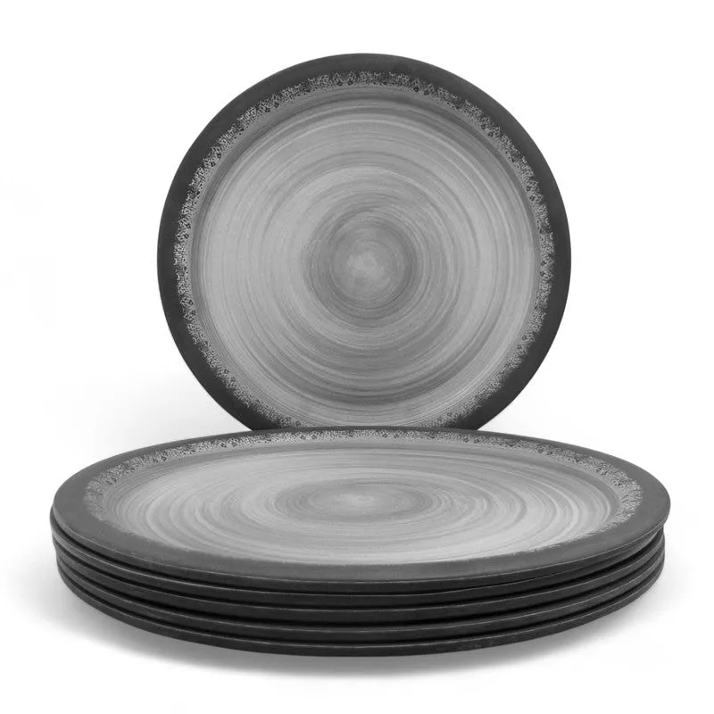 Black and grey plate standing behind a neatly stacked set