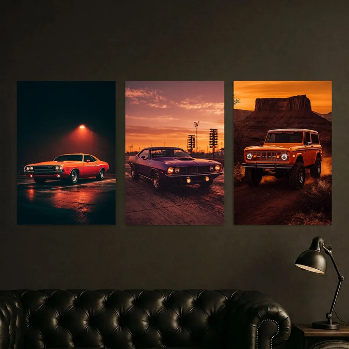 Three motorsport posters with vintage cars on a dark wall above a sofa