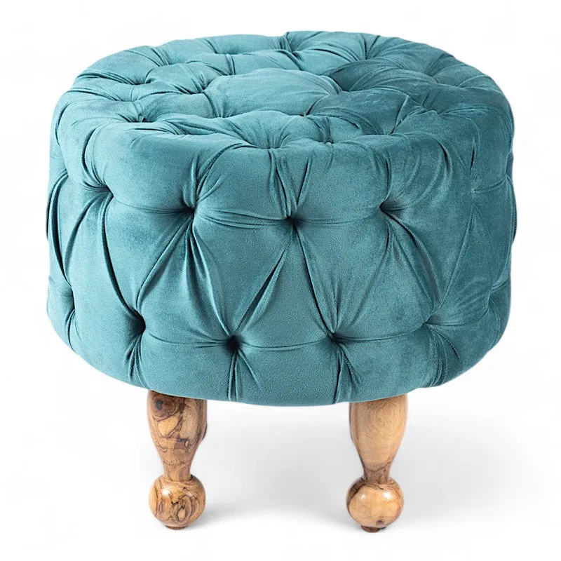 Blue round tufted ottoman with turned wooden legs