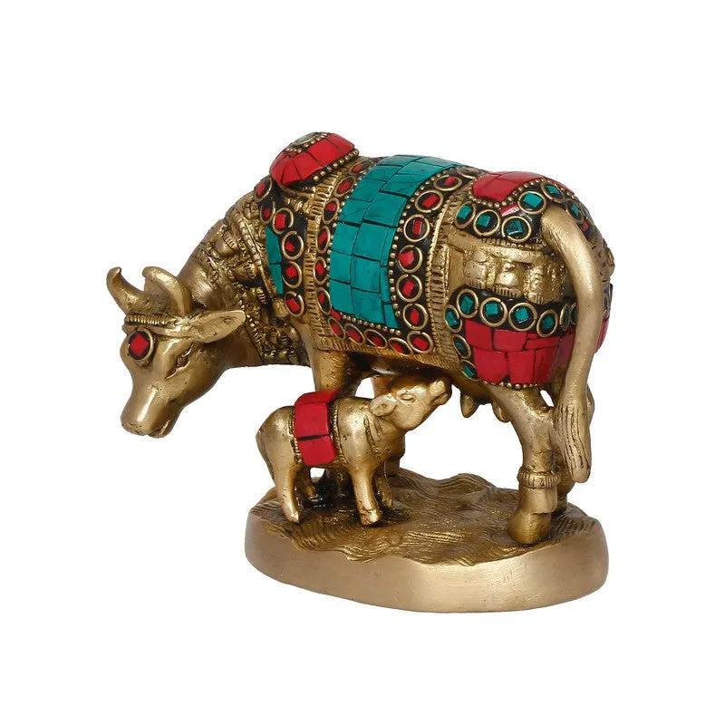 Side view of Gau Mata brass idol with calf and colourful accents
