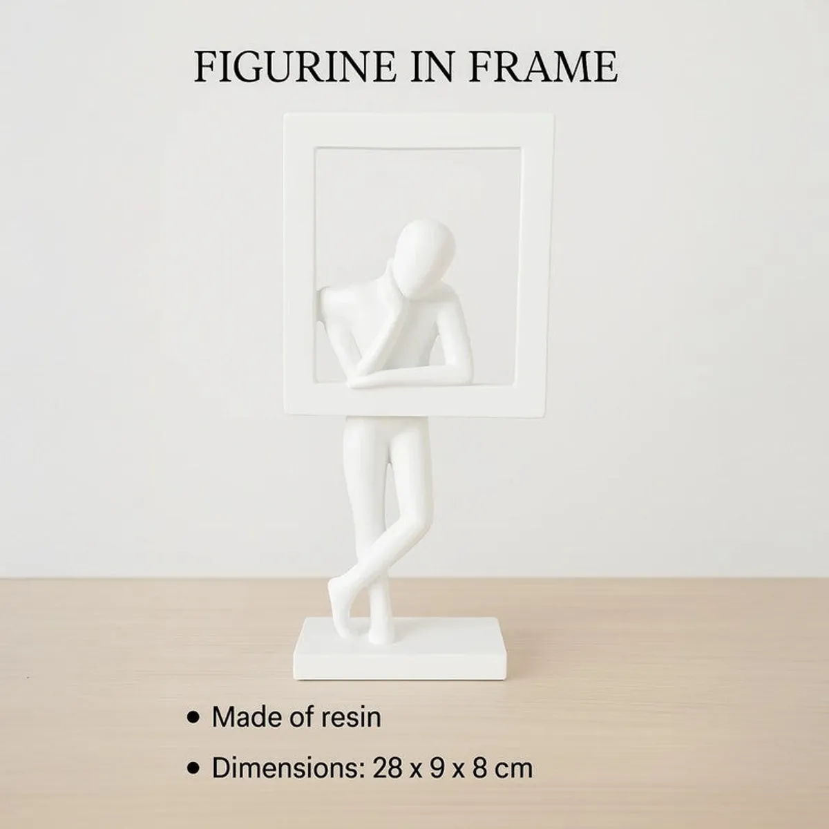 White framed figurine showpiece displayed on a tabletop