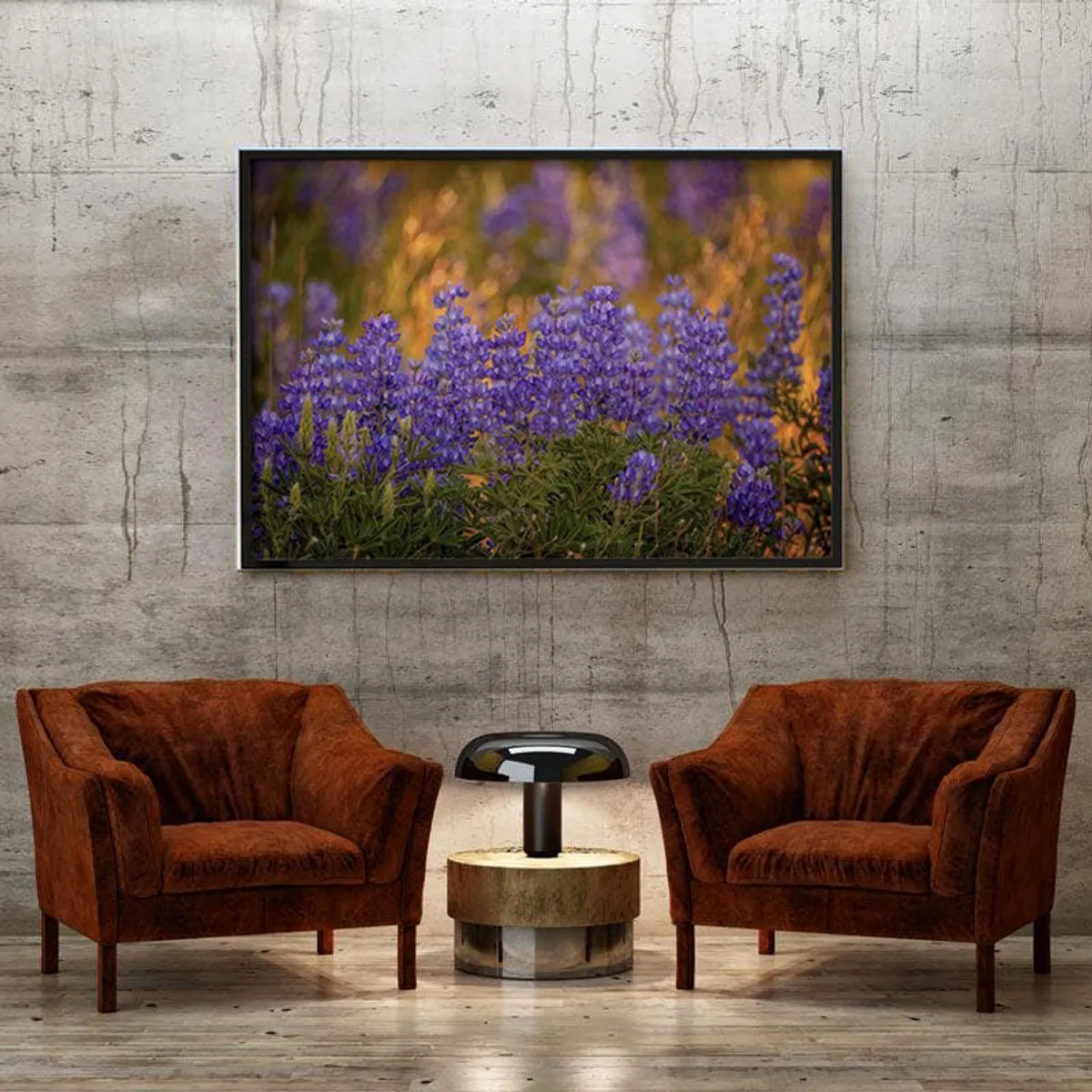 Black-framed floral wall art above two brown armchairs