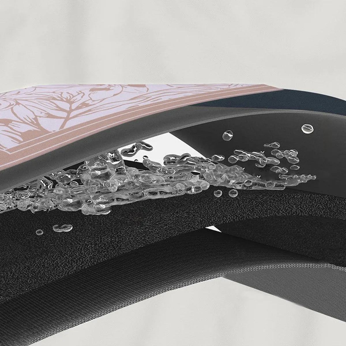 Peach and grey floral bath mat shown in profile.