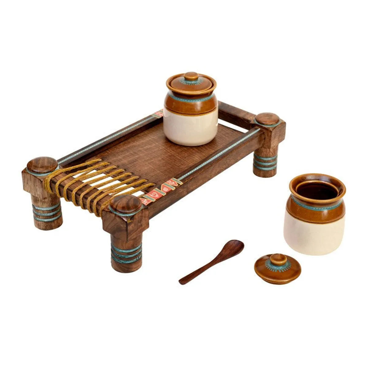 Ceramic condiment jar and lid beside a wooden charpoy-style tray