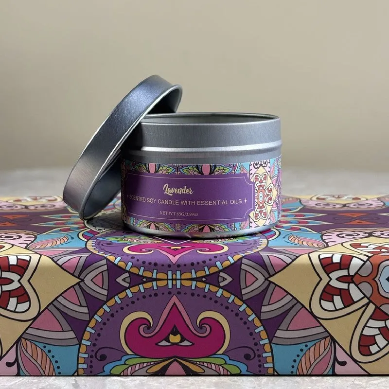 Silver-lidded scented candle tin on a colourful patterned surface