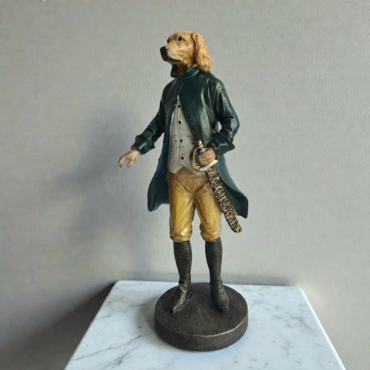 Dog gentleman showpiece displayed on a white marble surface