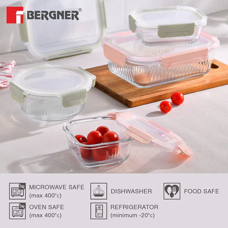 Several transparent glass food containers with pastel lids arranged on a kitchen counter.