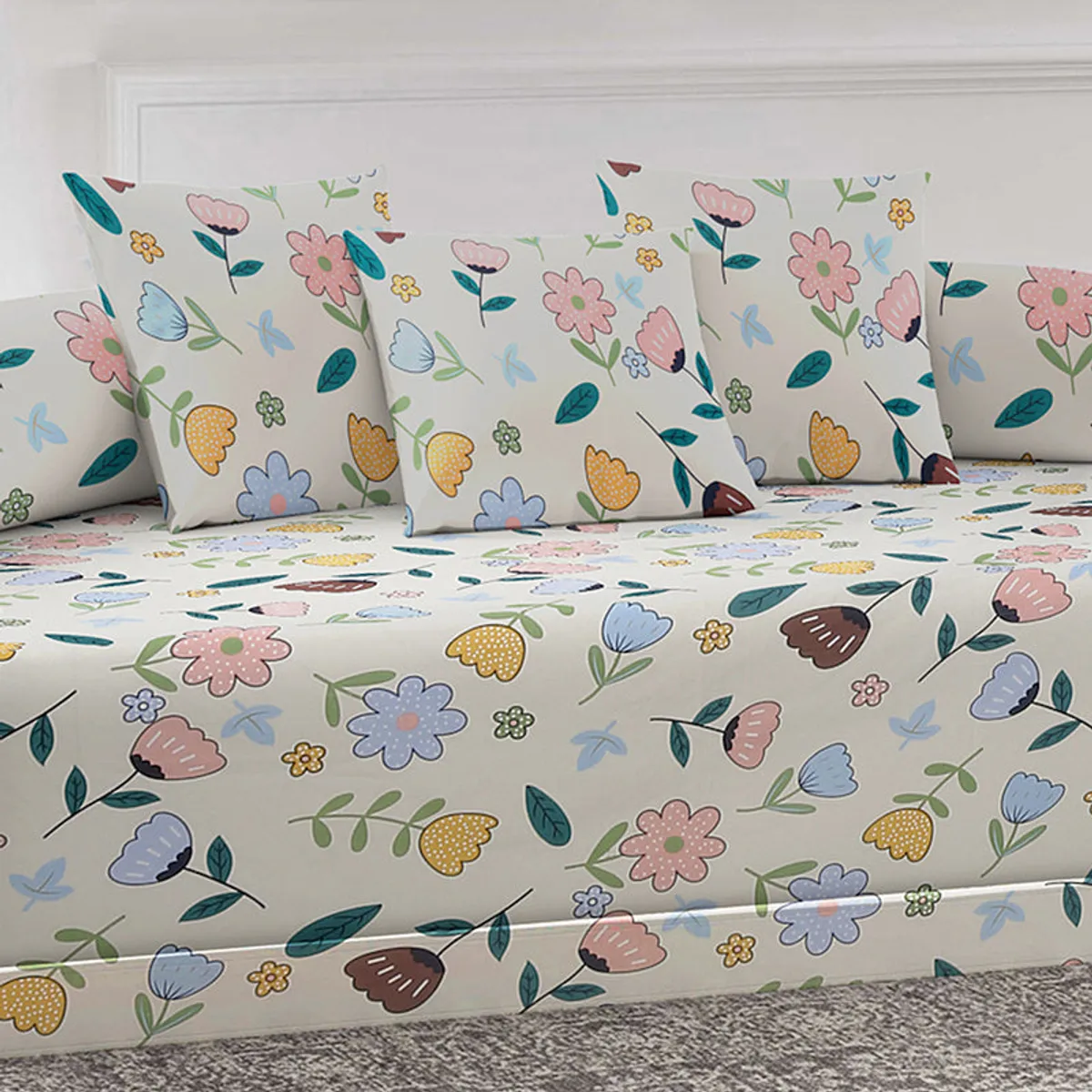 Close view of the floral diwan bedsheet and matching cushion covers