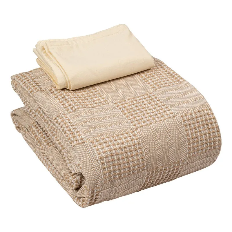 Folded beige bedsheet with matching pillow cover on white background